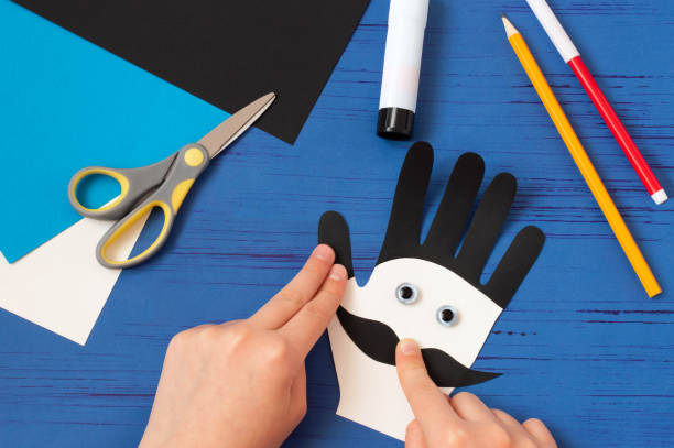 istock Child makes card for Father's Day. Step 9 1221395787