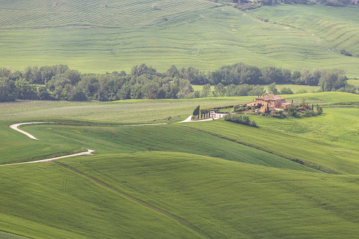 The Val d'Orcia in Tuscany. The area has been protected by UNESCO as a World Heritage Site. The landscape's distinctive aesthetics, flat chalk plains out of which rise almost conical hills with fortified settlements on top, inspired many artists. Their images have come to exemplify the beauty of well-managed Renaissance agricultural landscapes.