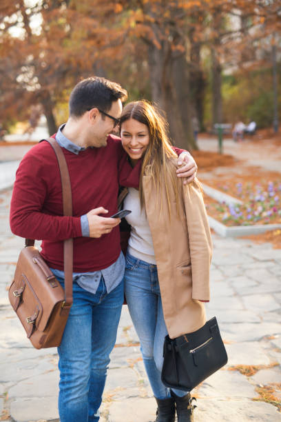 istock Couple in the park hugging. 1221402451