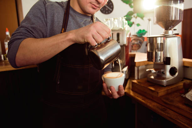 istock Coffee Latte Barista making pattern in a cup of coffee shop. 1221402960