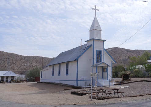 Wide shot of the Santa Barbara Church in Randsburg, a gold mining town in the late 1890s in California.