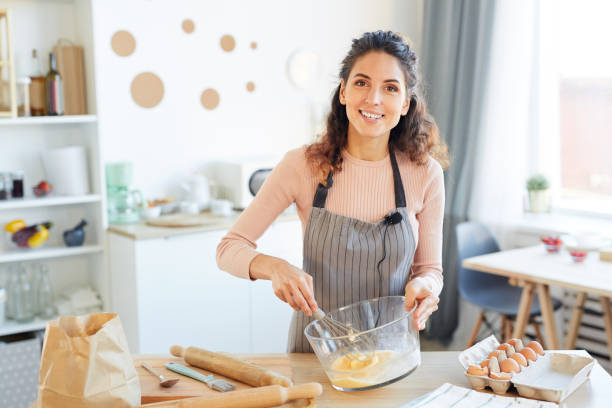 istock Food Blogger Beating Up Eggs 1221405150