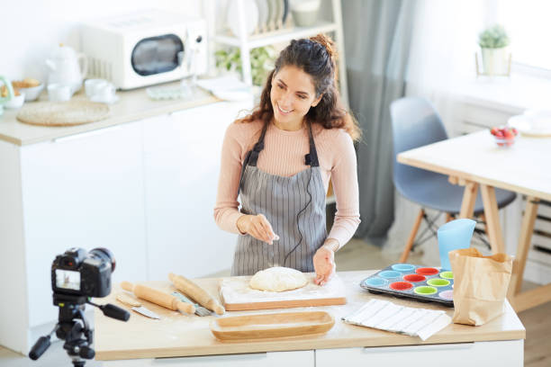 istock Food Blogger Preparing Dough 1221405200