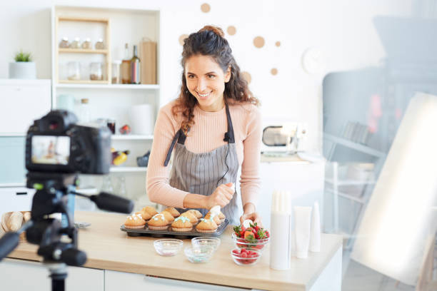 istock Joyful Woman Cooking On Camera 1221405772