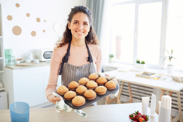 Happy Woman With Cupcakes Baked