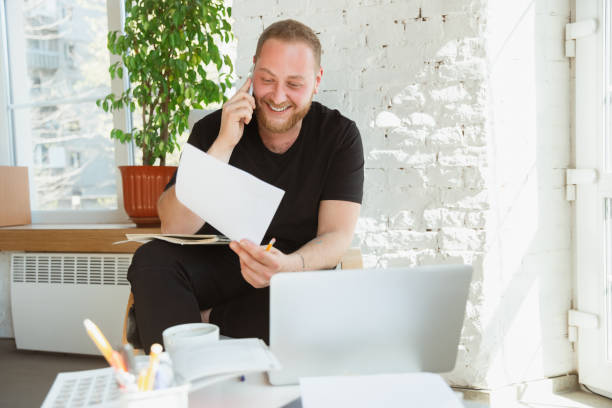 Young man studying at home during online courses for managers, marketers, buyers