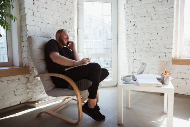 Young man studying at home during online courses for managers, marketers, buyers