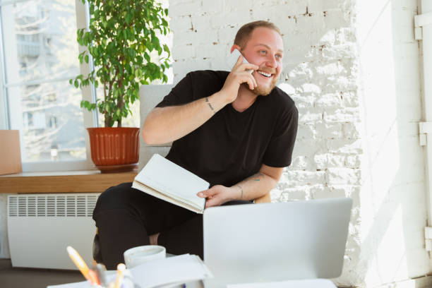 istock Young man studying at home during online courses for managers, marketers, buyers 1221405933