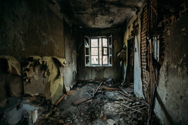 istock Burnt old rural house interior. Consequences of fire 1221407034