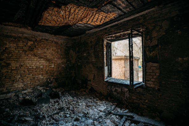 istock Burnt old rural house interior. Consequences of fire 1221407035