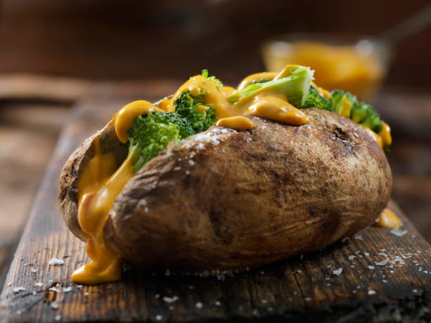 Cheese and Broccoli Stuffed Potatoes Cheese and Broccoli Stuffed Potatoes Jacket Potato stock pictures, royalty-free photos & images