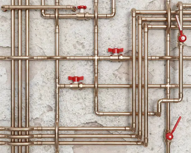 Photo of Copper water pipes with red faucets in front of damaged wall, 3d illustration