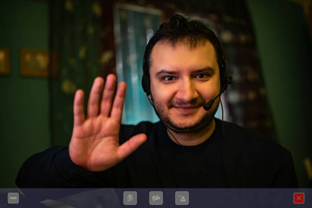 istock Smiling man having a video chat at home 1221408685