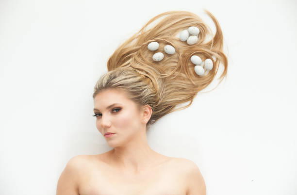 istock Caucasian female lying down in front of white background 1221409117