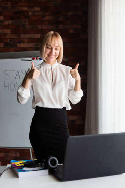 istock Woman teaches online learning 1221410415