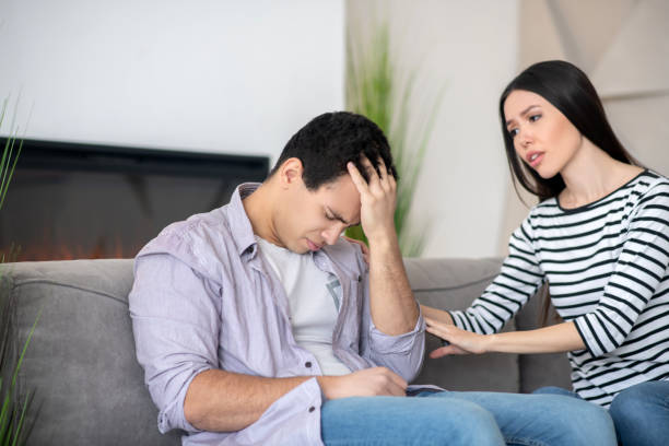 istock Unhappy guy bowed his head with his eyes closed. 1221411214