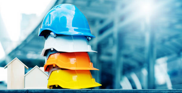 istock Multicolored Safety Construction Worker Hats. Teamwork of the construction team must have quality. Whether it is engineering, construction workers. Have a helmet to wear at work. For safety at work. 1221412599