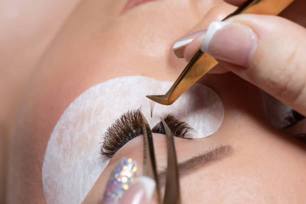 istock Eyelash Extension Procedure. Woman Eye with Long Eyelashes 1221413307