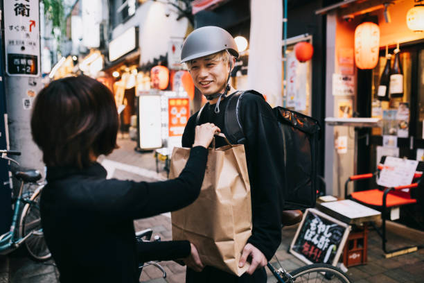 istock Bike Courier Receiving A Delivery 1221414835