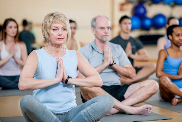 istock Group of yoga enthusiasts 1221415613