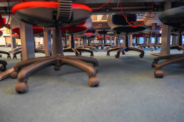 istock Low angle view of office chairs and desks 1221416627