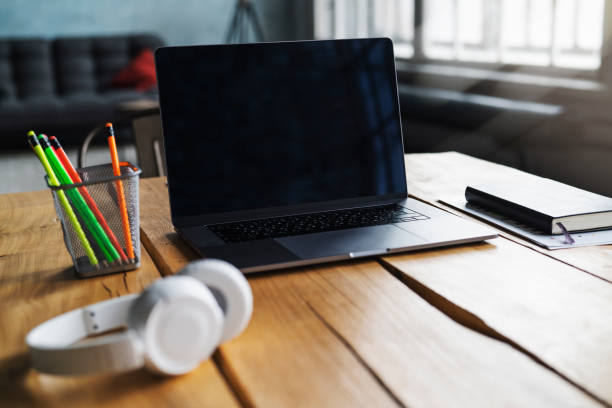 istock Workplace with laptop, headphones, pencils and copybook. Great educational apps and programs on Internet 1221416702