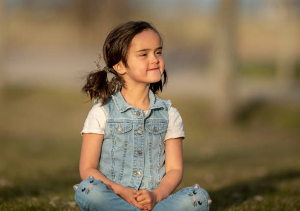 Cute little girl playing outside.