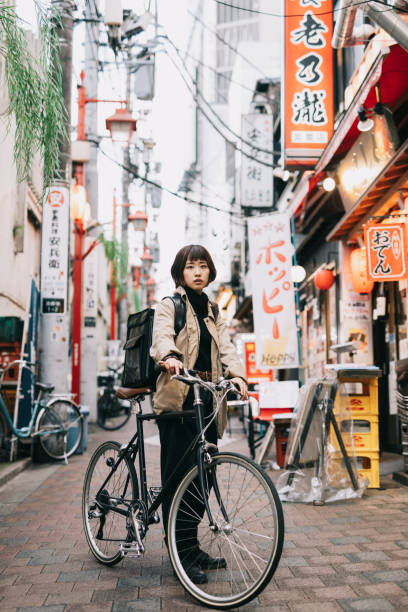 istock Food Courier With Her Bicycle 1221418581