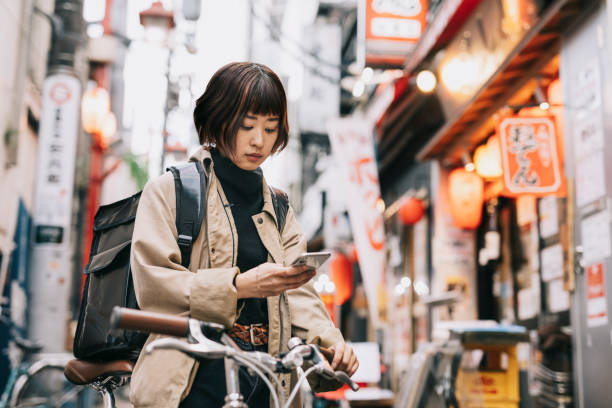 istock Bike Courier Looking for a Restaurant 1221418735