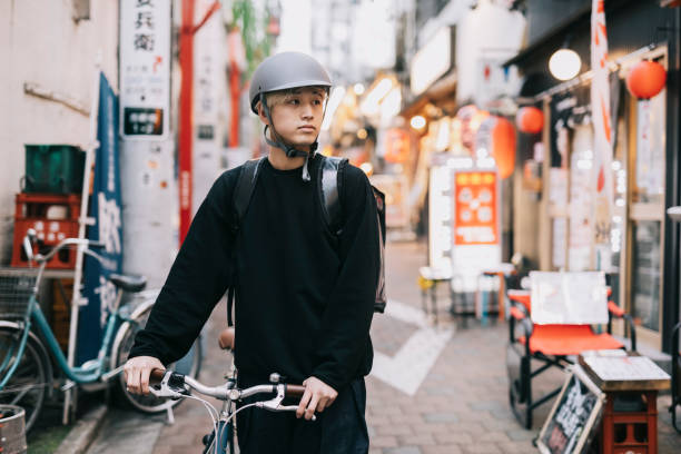 istock Young Asian Man Working as a Food Courier 1221418986