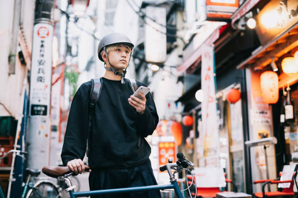 istock Bike Messenger Checking His Smartphone 1221419270