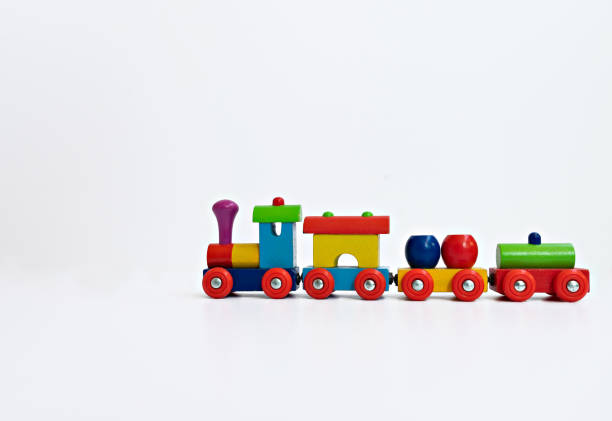 istock A close up of a multi-colored train toy on white background 1221419328