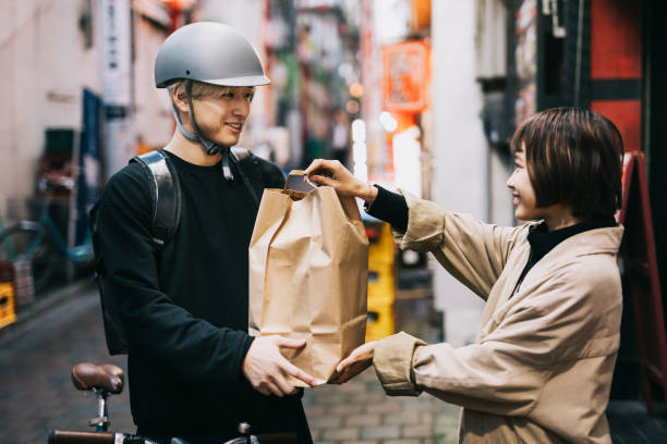 istock Bike Courier Receiving A Delivery 1221419357