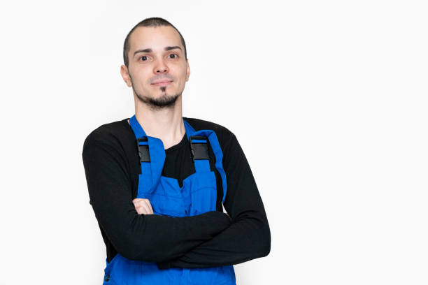 istock Professional repair, installation and maintenance technician. In a work suit 1221420101