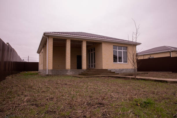 Single storey house. Isolated single storey house. Front View of one floor single family house.