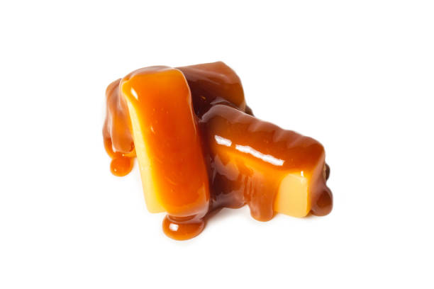 istock Tasty caramel candy isolated on white background. 1221420854