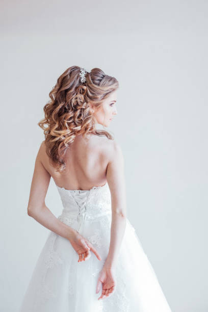 istock beautiful bride posing wedding hairstyle and dress 1221421902