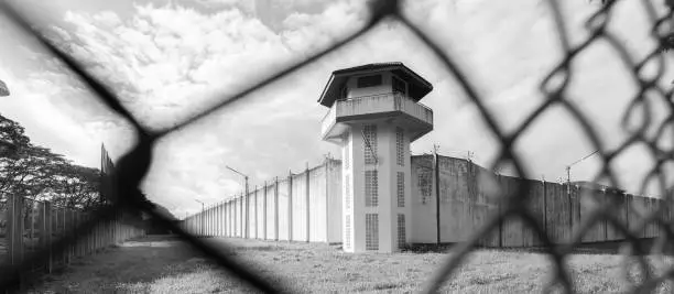 Photo of Prison with iron fences.Prison or jail is a building where people are forced to live if their freedom has been taken away.Prison is the building use for punishment prisoner.