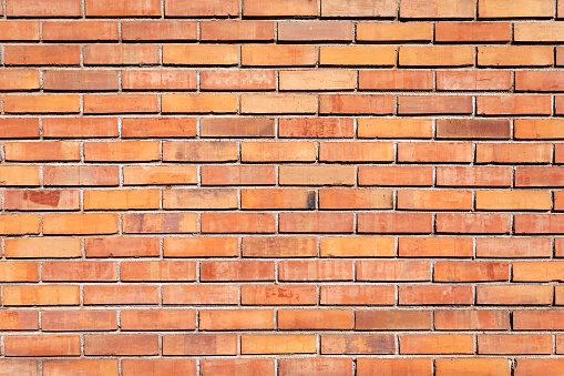 Close up photo of a red brick wall, brick wall of a building