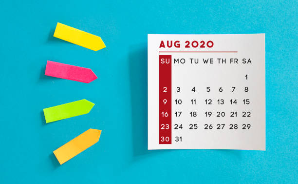 istock Calendar concept. August 2020 Calendar On The White note paper. Colored arrow-shaped sticky notes point to it. 1221423686