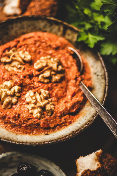 istock Turkish red pepper paste with wallnuts, simit bagels and parsley 1221424142