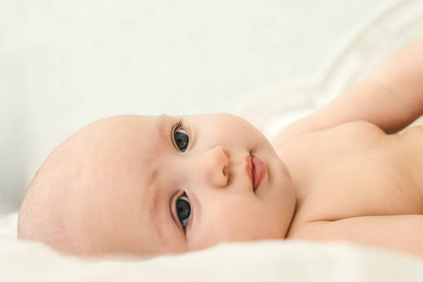 istock Naked baby on a light background. 1221424894