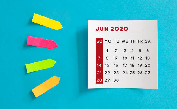 istock Calendar concept. June 2020 Calendar On The White note paper. Colored arrow-shaped sticky notes point to it. 1221426173