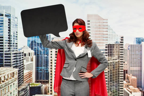 istock Heroines wearing cape - garment and holding speech bubble 1221426467