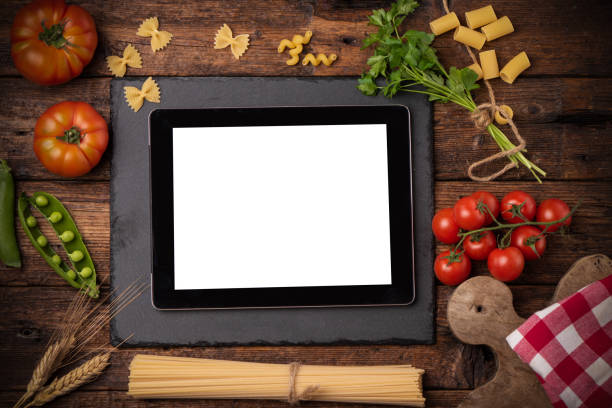 istock White tablet with copy space and ingredients for cooking Italian pasta on dark stone surface 1221428831