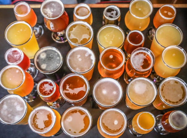 Craft Beer Tasting Craft beer tasting - Beautiful colorful beer sample at a microbrewery microbrewery photos stock pictures, royalty-free photos & images