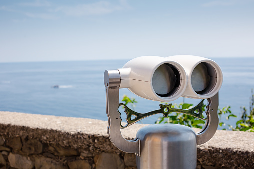 Coin operated binoculars on beach.