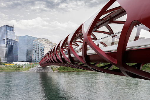 Calgary, Alberta, Canada - july, 27, 2018: The pedestrian Peace Bridge that spans across the Bow River is the gateway to the city downtown