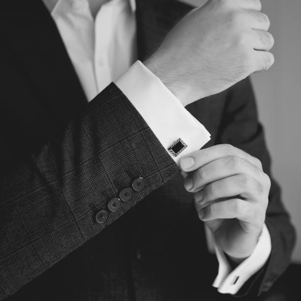 hands of wedding groom getting ready in suit - chain smoking imagens e fotografias de stock