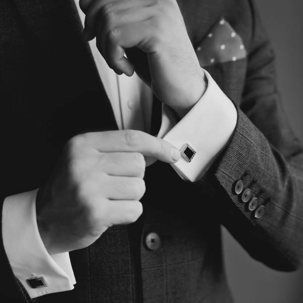 istock Hands of wedding groom getting ready in suit 1221432003